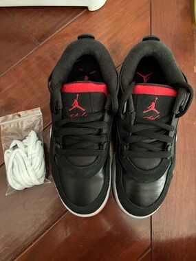 Nike AirJordan 4 RM (GS) in Black/Red/Wolf Grey color.Low-Top Sneakers.Brand new